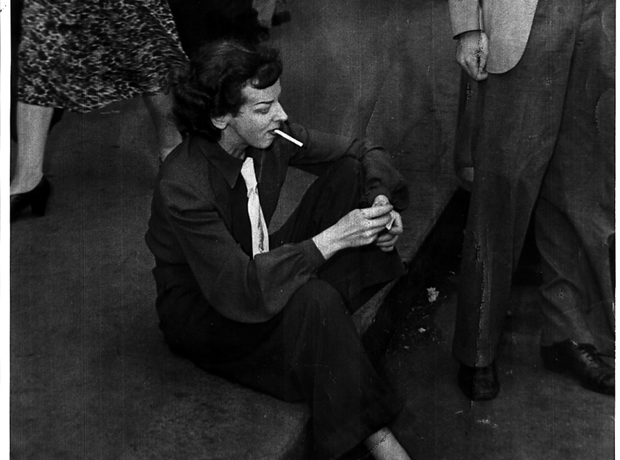 Rosaleen Norton sitting in the gutter and smoking